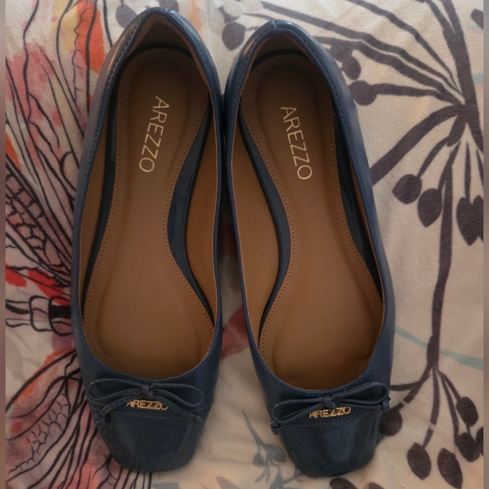 Arezzo blue flats with a bow and emblem NWOT